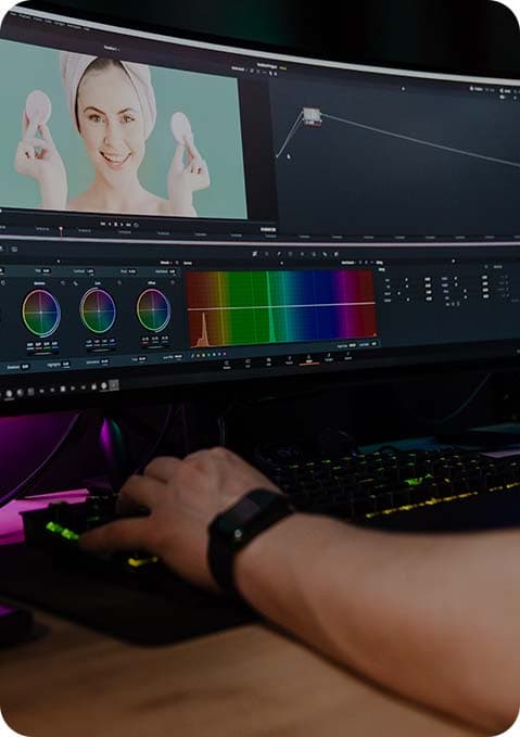 Video editor editing footage on a computer